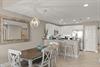 Picture yourself preparing meals in this bright, fullyequipped kitchen or enjoying coffee at the breakfast bar.