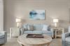 Unwind in your living room, where calming blues and soft grays create a peaceful retreat.