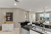 This bright, openconcept space seamlessly connects your kitchen and living area.
