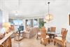 Natural light fills the bright space, where wicker chairs and beachinspired décor set a tranquil coastal tone.