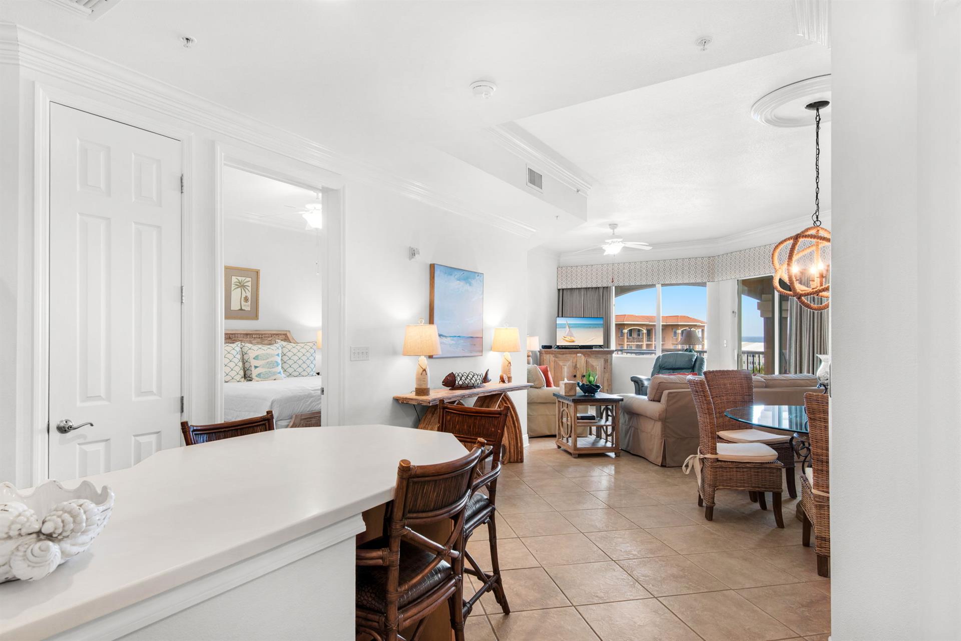 Gather around the inviting living and dining spaces, perfect for morning coffee or unwinding after a beach day.