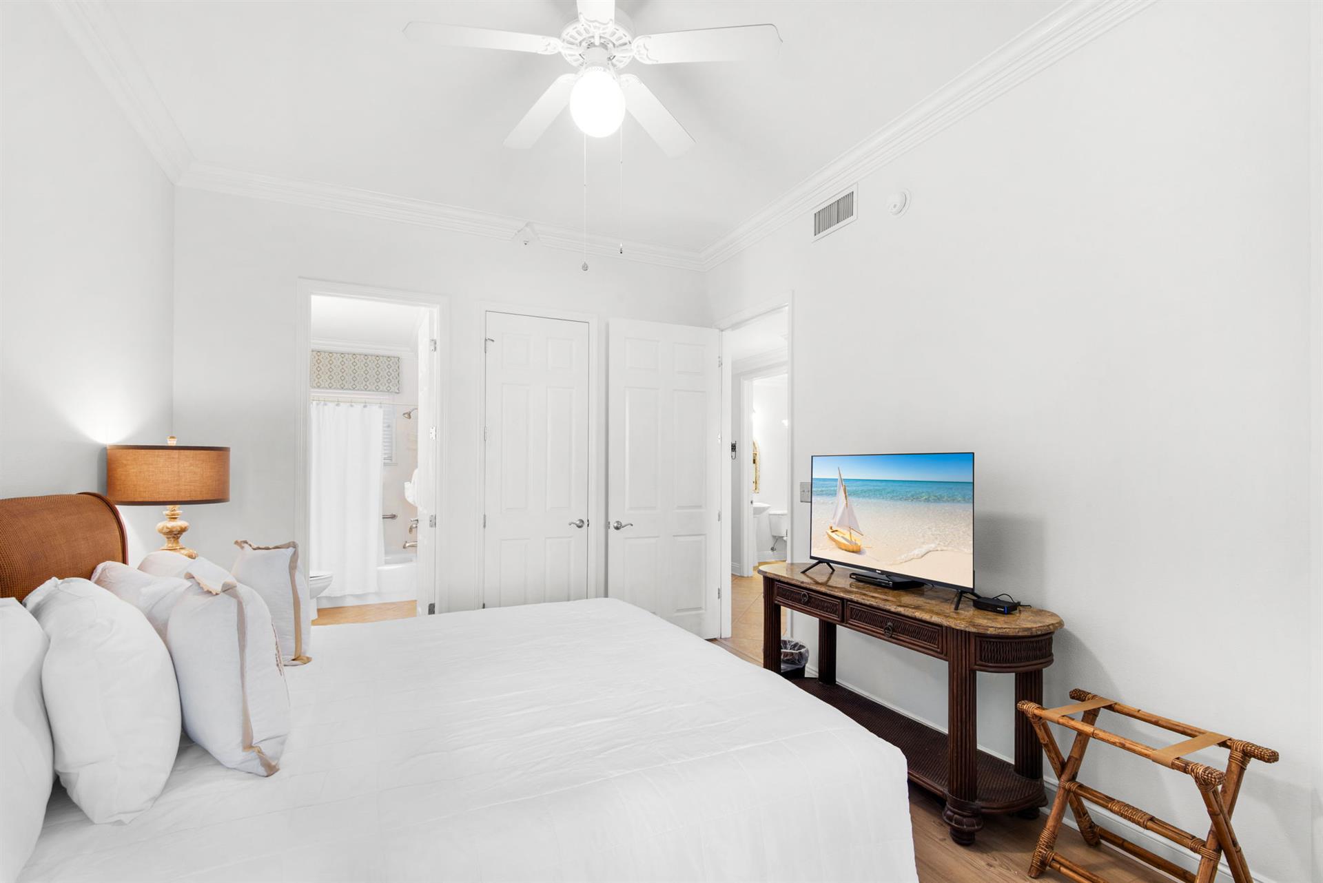 Drift off to sleep in this serene bedroom where coastal charm and modern comforts create your perfect retreat.