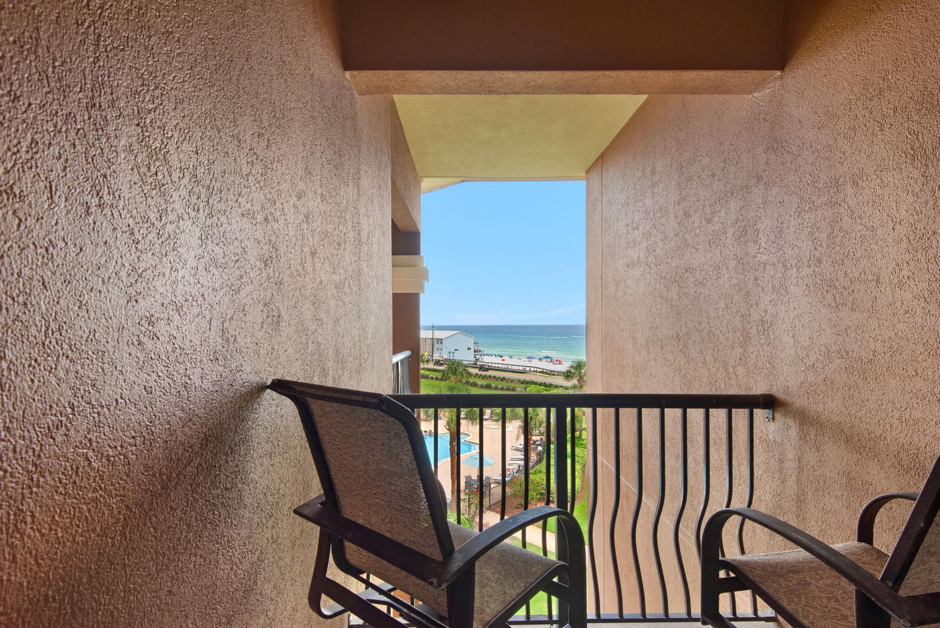 Your balcony frames stunning gulf and pool views.