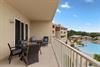 Private patio with outdoor seating, just off the living room and primary bedroom.
