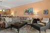Openconcept living space, where warm tones and curated artwork create a relaxing retreat after your beach or lake adventures.