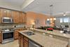 Picture yourself preparing meals on granite counters in the fullyequipped kitchen, then relaxing in the open living area with windows framing lush views.