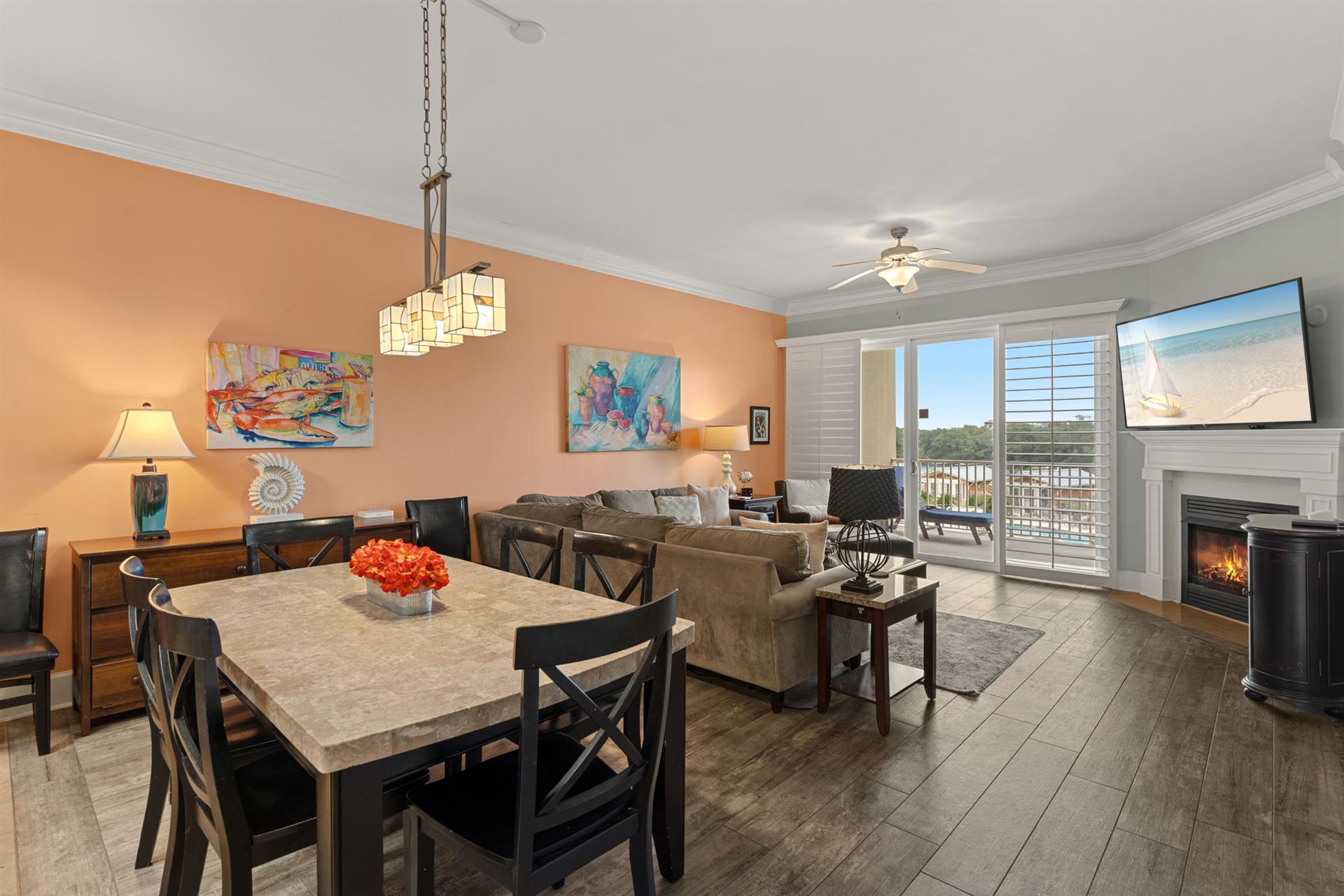 Picture yourself relaxing in this inviting openconcept space, with warm tones set a tranquil mood. Enjoy meals together at the dining table, unwind by the fireplace, and soak in the views from your p
