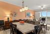 Spacious openconcept living and dining area, create a welcoming atmosphere. Natural light pours in, inviting you to unwind or gather for meals together.