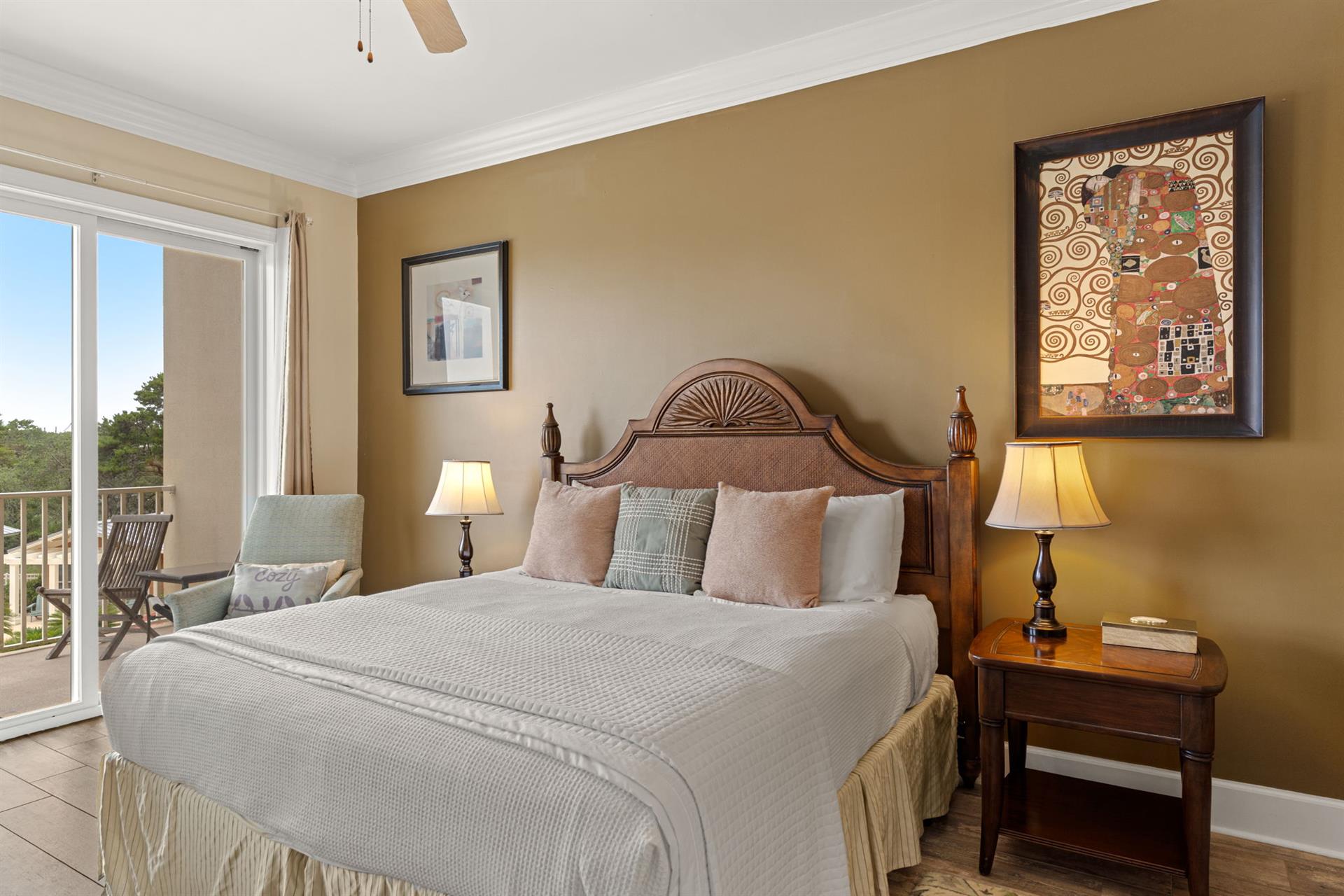 Sink into crisp linens and cozy pillows in this peaceful king retreat, where warm tones and artwork create a welcoming ambiance. Step outside to your private balcony and unwind.