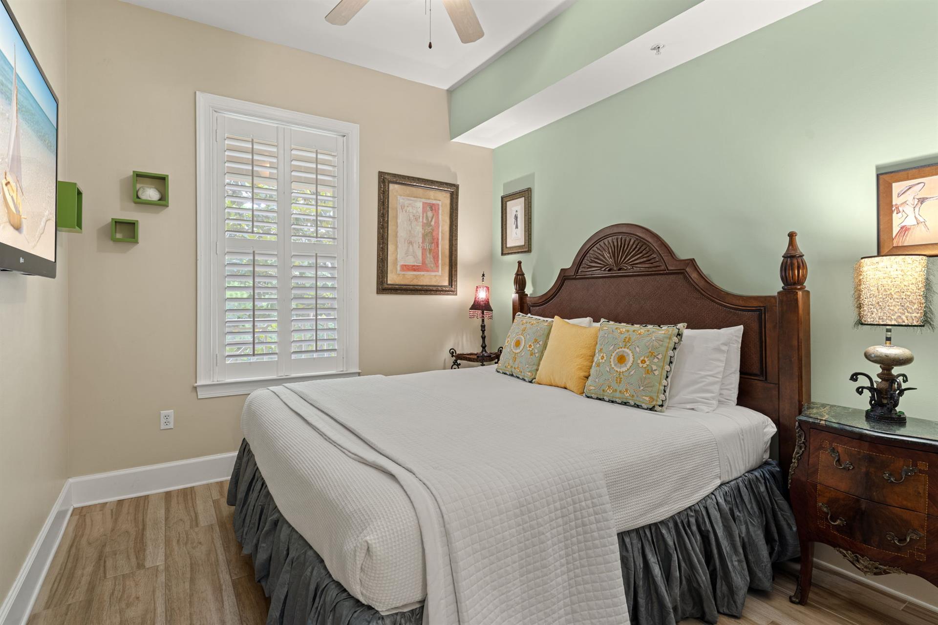 Spacious king guest bedroom with warm coastal tones, and an onsuite bathroom.