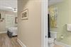 Private king guest suite combines bright, cheerful decor with thoughtful conveniences, a cozy bedroom flows to a fresh, lightfilled bathroom just steps away.