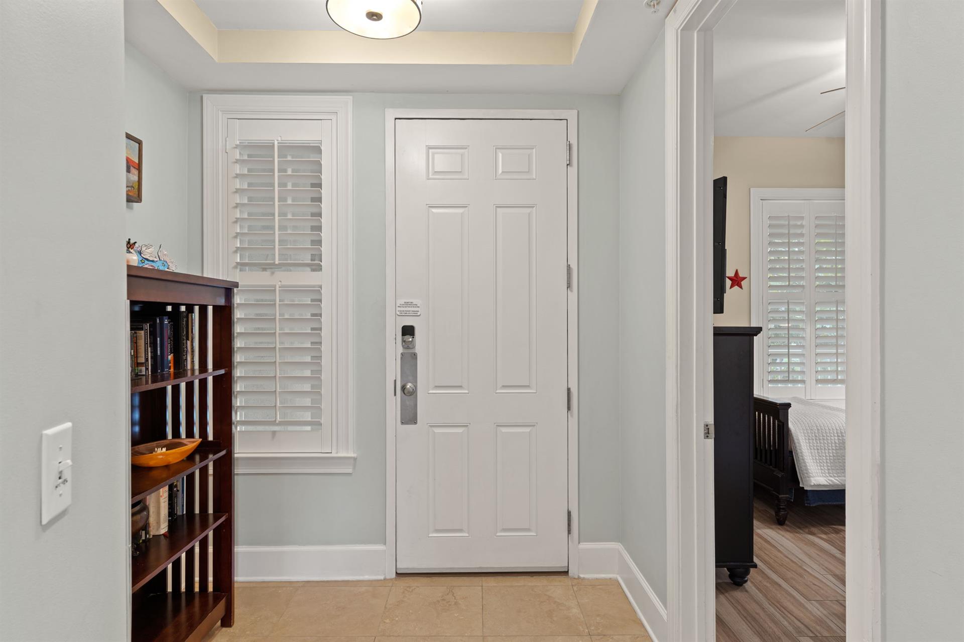 Step into your welcoming entryway, where soft lighting and clean lines set a calm, organized tone.
