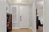 Step into your welcoming entryway, where soft lighting and clean lines set a calm, organized tone.