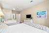 Along with two queen beds, enjoy modern comforts like a flatscreen TV, ceiling fan, and peaceful beachthemed décor.