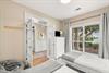 Youll love how the soft morning light fills this peaceful bedroom, creating a serene space to unwind.