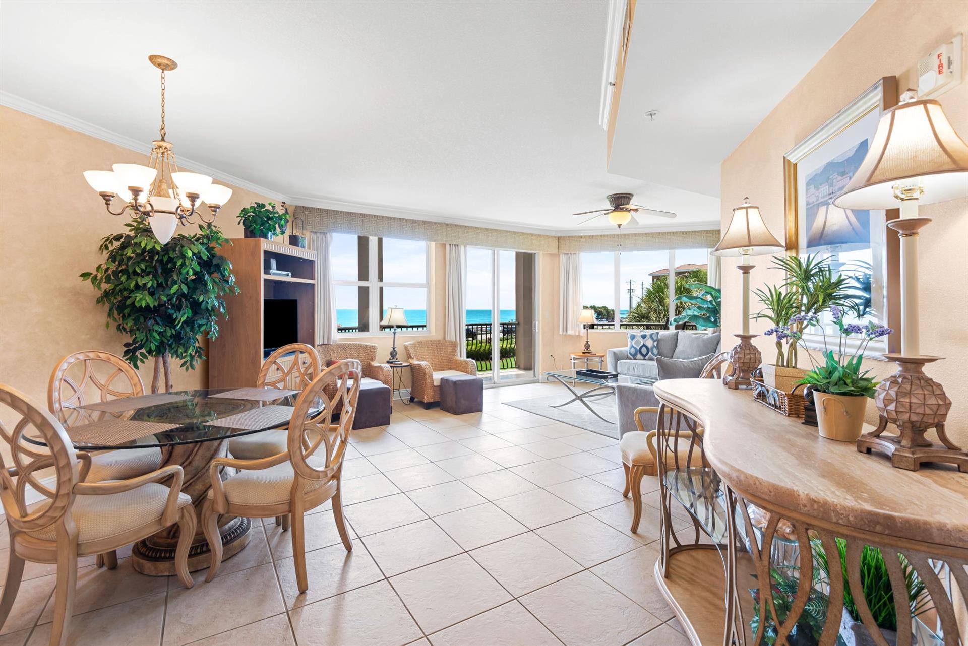 Openconcept living space where turquoise waves greet you through floortoceiling windows.