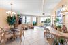 Openconcept living space where turquoise waves greet you through floortoceiling windows.