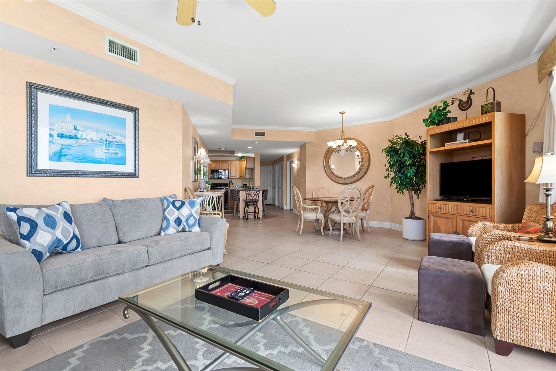 Relax with a comfy sofa, dining area, and fully equipped kitchen—perfect for beachside getaways.