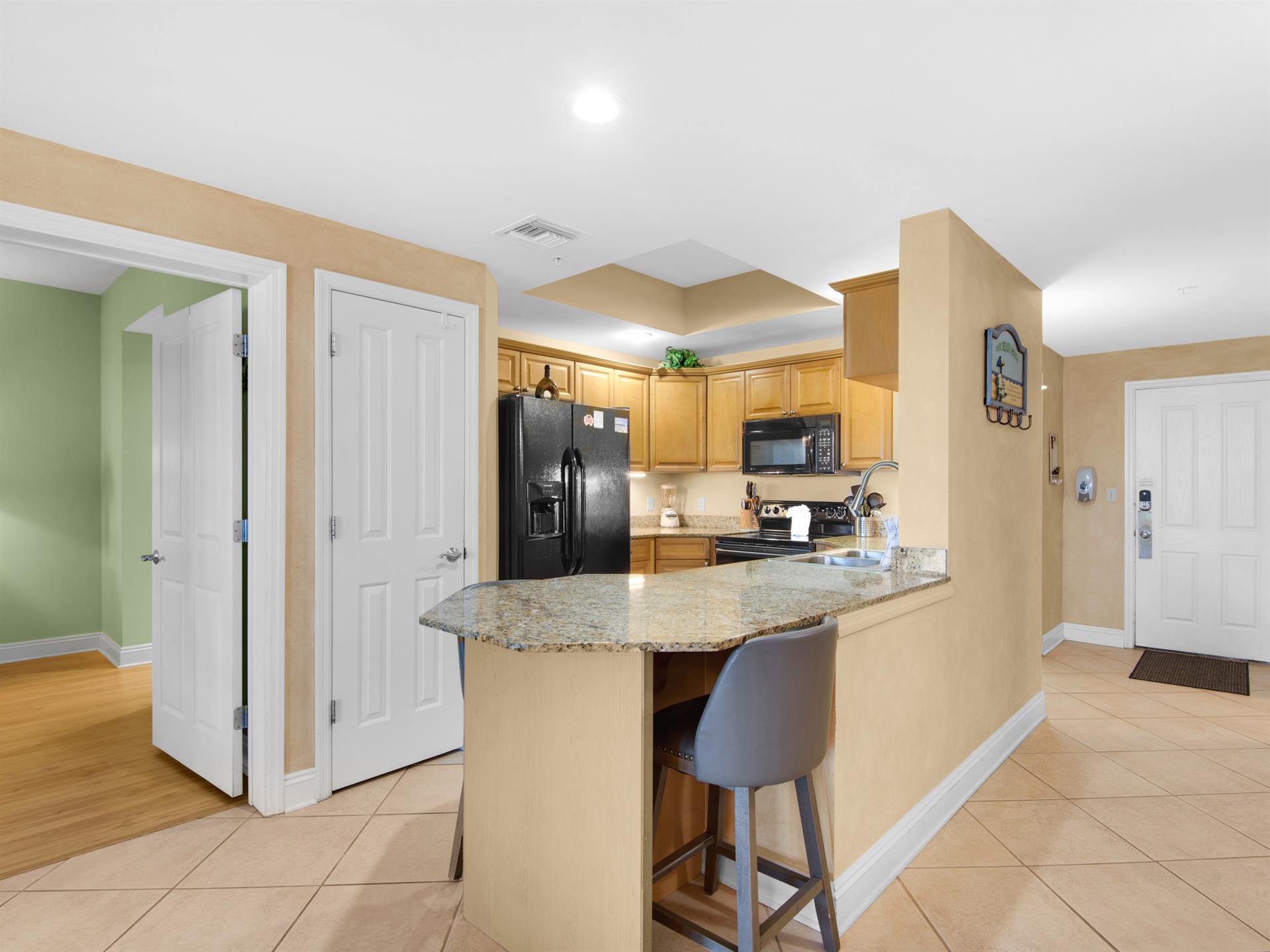 The kitchen also features a breakfast bar—perfect for  enjoying morning coffee.