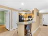 The kitchen also features a breakfast bar—perfect for  enjoying morning coffee.