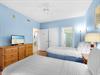 Soft blue walls and comfortable beds invite restful sleep.