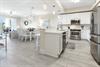Your bright, openconcept kitchen and dining space invites you to gather, cook, and share meals, all while soaking in the coastal light and comfortable, modern finishes that make this home feel effort