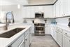 Step into your bright, fully equipped kitchen with stainless steel appliances, marble countertops, and all the tools you need to whip up delicious meals at home.