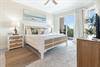 Your serene coastal retreat awaits with a plush bed, soothing oceaninspired decor, and private balcony access where you can unwind with natural light and refreshing breezes.
