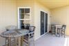 Step onto your private covered balcony where two seating areas invite you to savor morning coffee or evening conversations in the fresh air.
