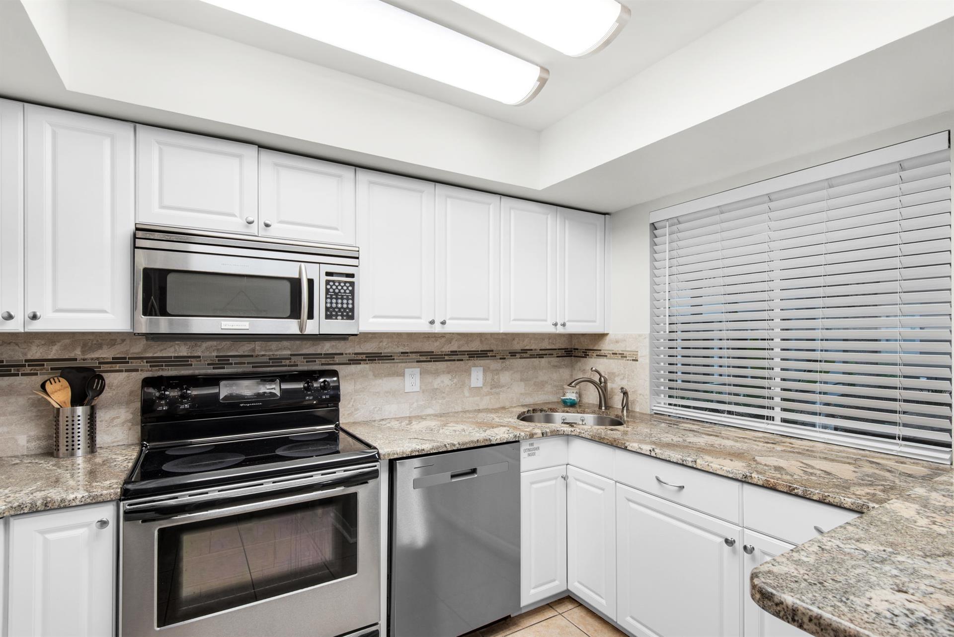 Cook your favorite meals in this fully equipped kitchen with modern appliances and ample counter space for all your culinary adventures.