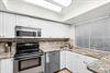 Cook your favorite meals in this fully equipped kitchen with modern appliances and ample counter space for all your culinary adventures.