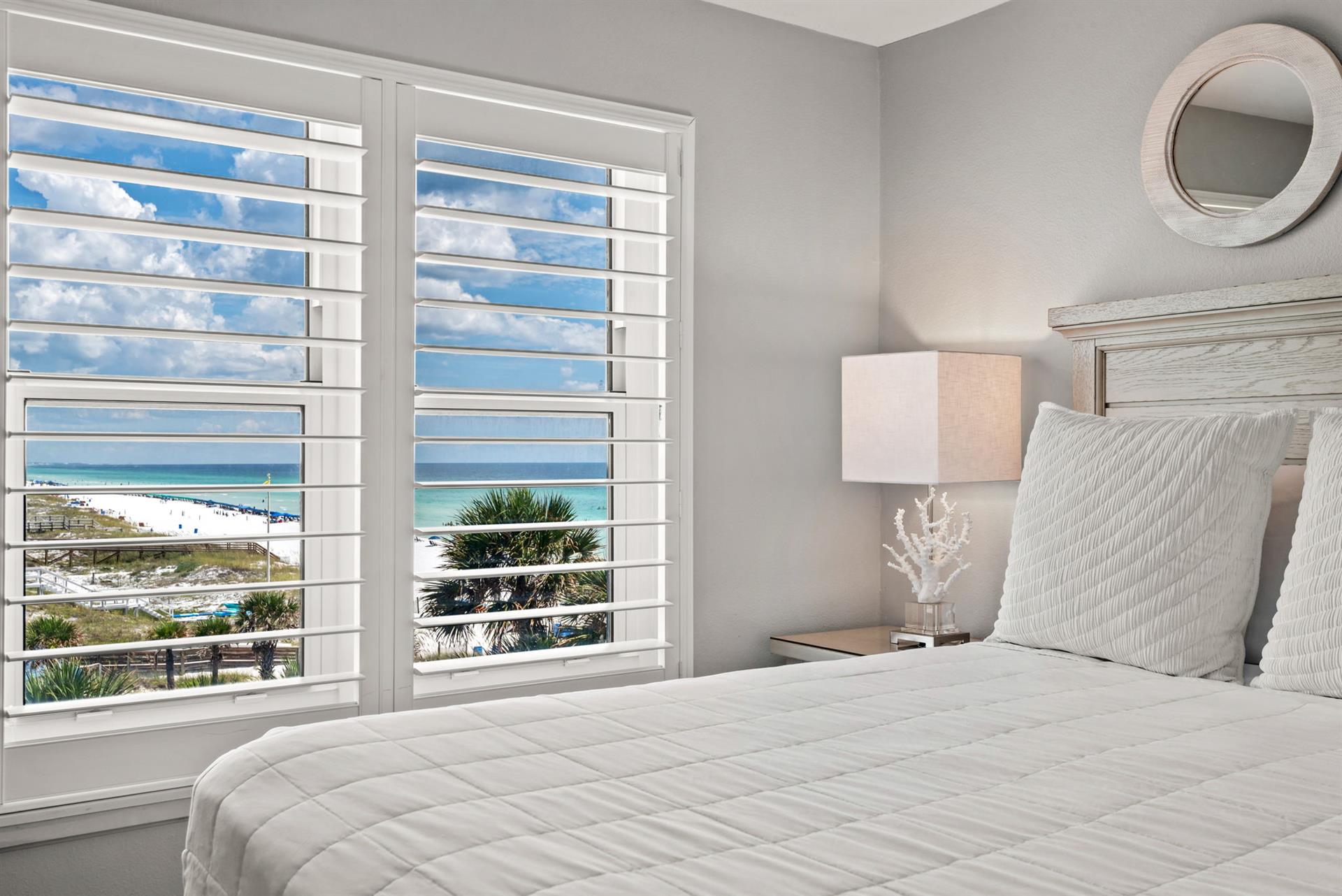 Wake up to stunning ocean views framed by elegant plantation shutters.