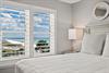Wake up to stunning ocean views framed by elegant plantation shutters.