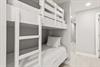 Cozy builtin bunk beds offer a stylish sleep space perfect for families or groups.