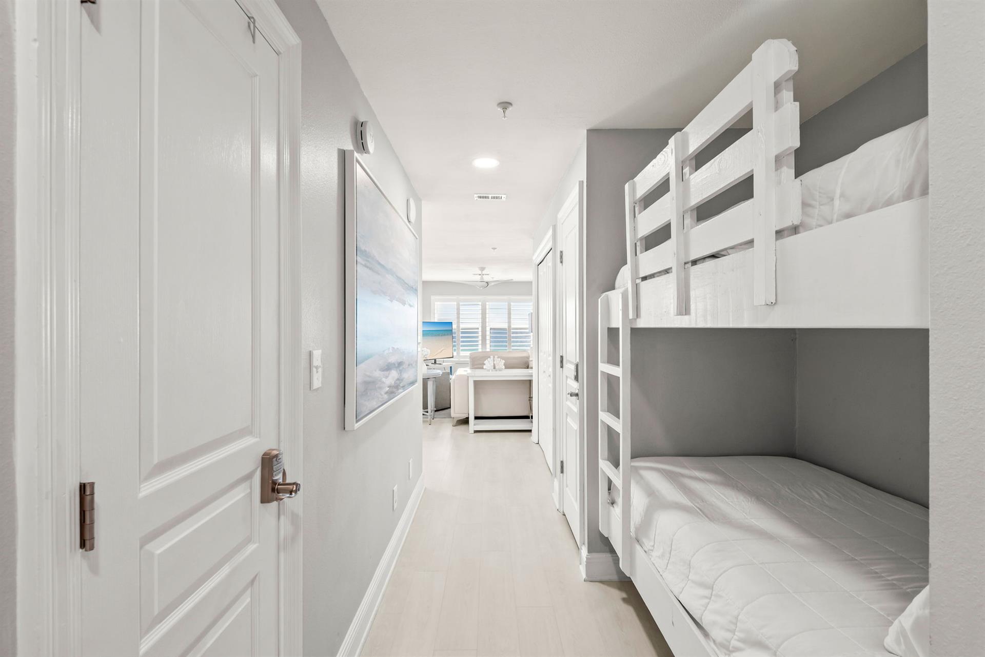 Bright hallway connects your sleeping quarters to the rest of the space, with a cozy bunk nook perfect for kids.