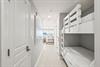 Bright hallway connects your sleeping quarters to the rest of the space, with a cozy bunk nook perfect for kids.