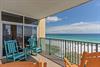 Settle into your private balcony where brilliant turquoise waters and soft white sands stretch endlessly before you, inviting peaceful mornings in colorful rocking chairs.