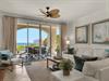 Living area with balcony access and Gulf views
