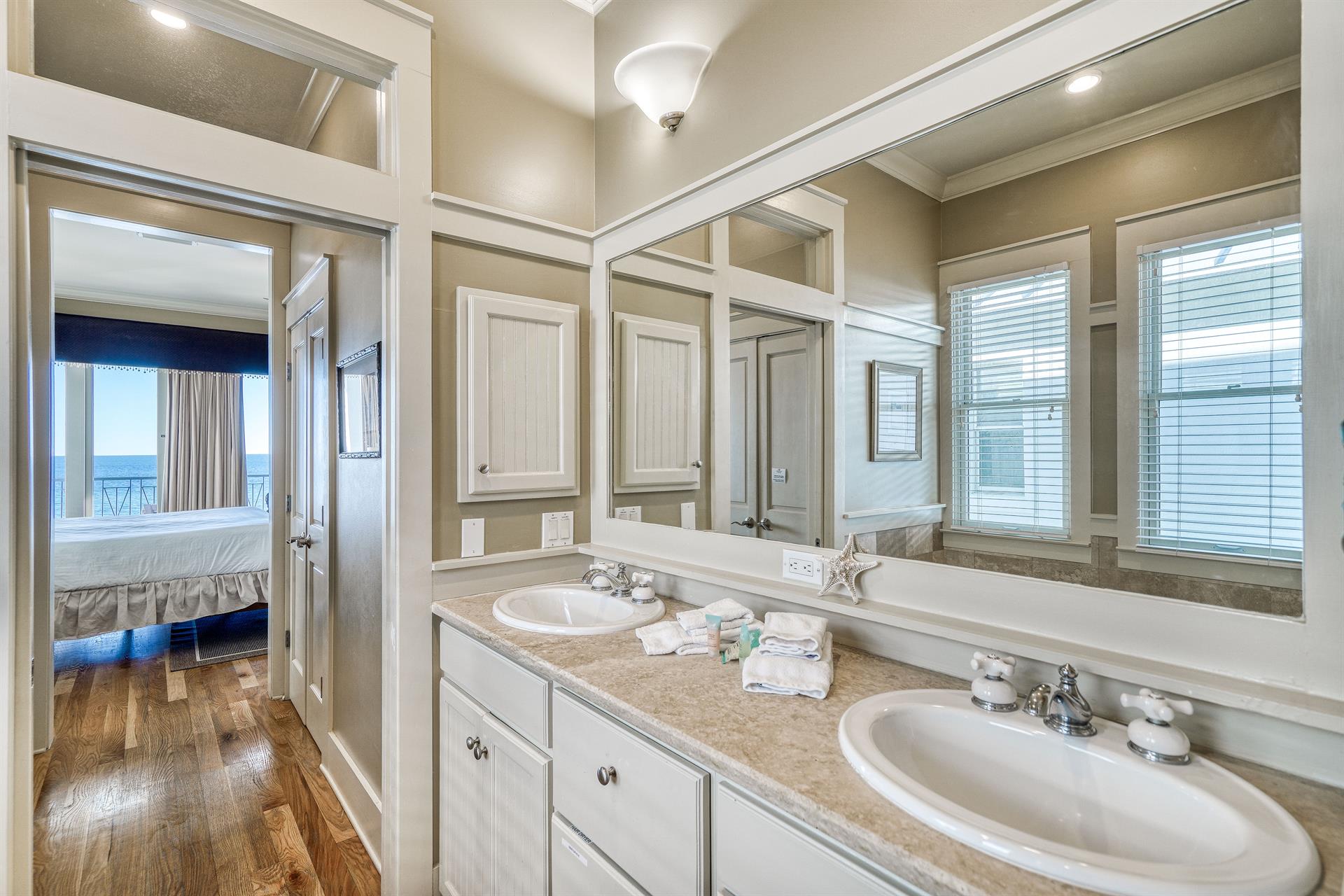 Primary Ensuite Bathroom with Double Travertine Balconies