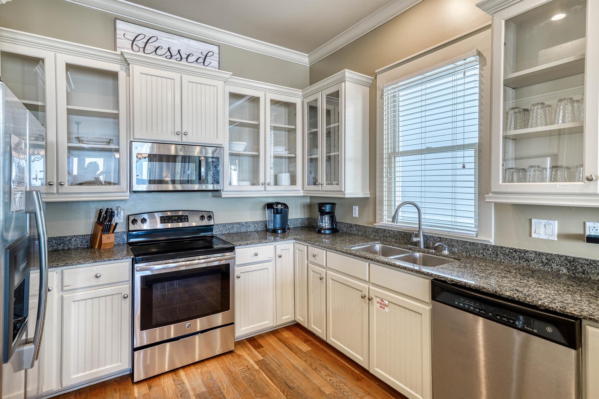 Open Kitchen with Granite Countertops, Stainless Steel Appliances,  Custom Cabinetry Stocked with Cookware  Dinnerware