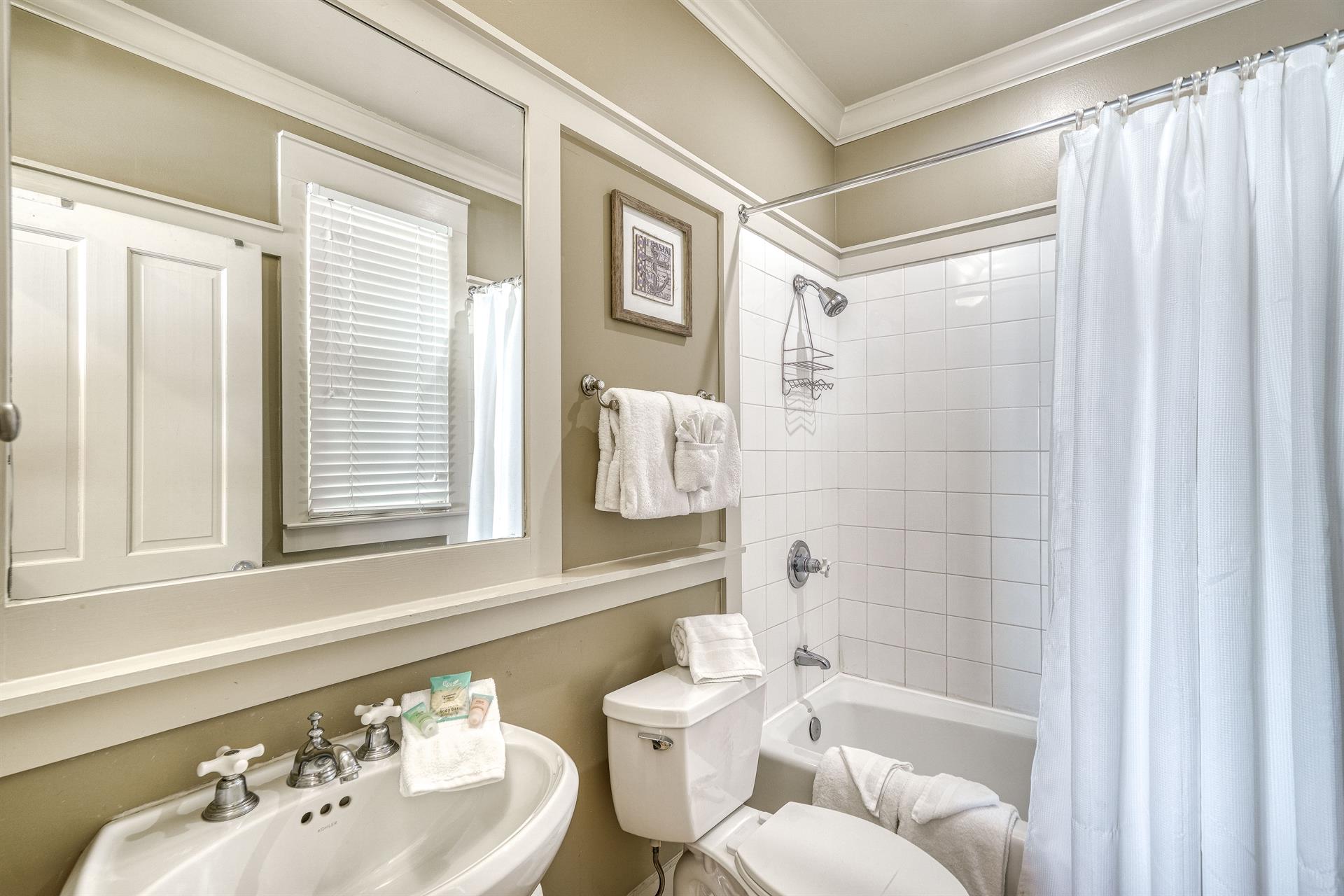 1st Floor Ensuite Bathroom for the King Beachfront Bedroom with Pedestal Sink, Bathtub  Shower Combination