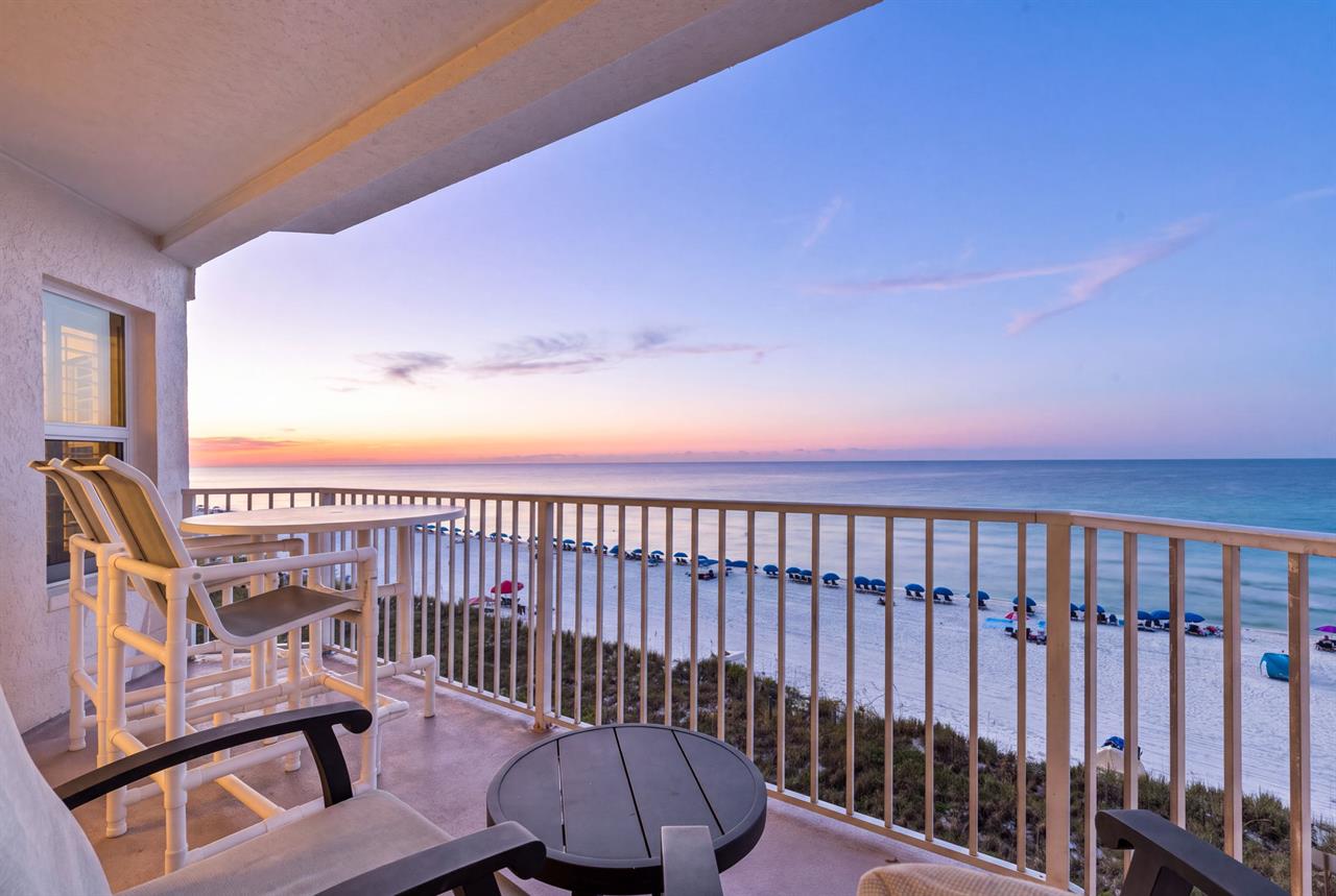 Step onto your private balcony and soak in the breathtaking ocean view as the sun sets, painting the sky in warm hues—your peaceful retreat above the sand.