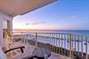 Step onto your private balcony and soak in the breathtaking ocean view as the sun sets, painting the sky in warm hues—your peaceful retreat above the sand.