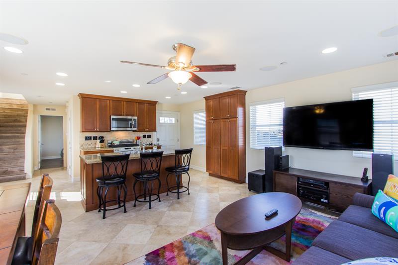 Open concept living room with large TV
