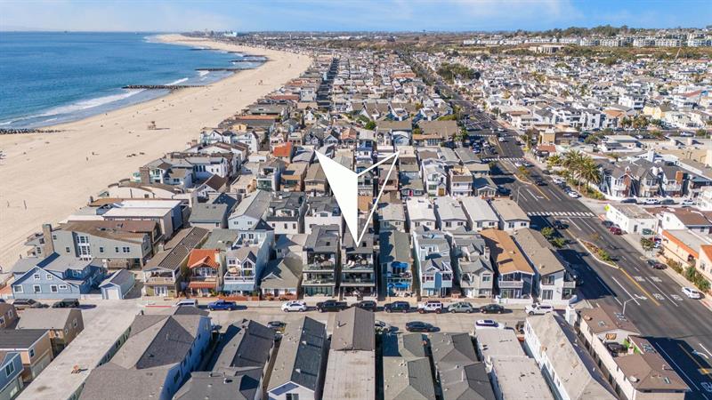 Aerial view of area with home pinpoint