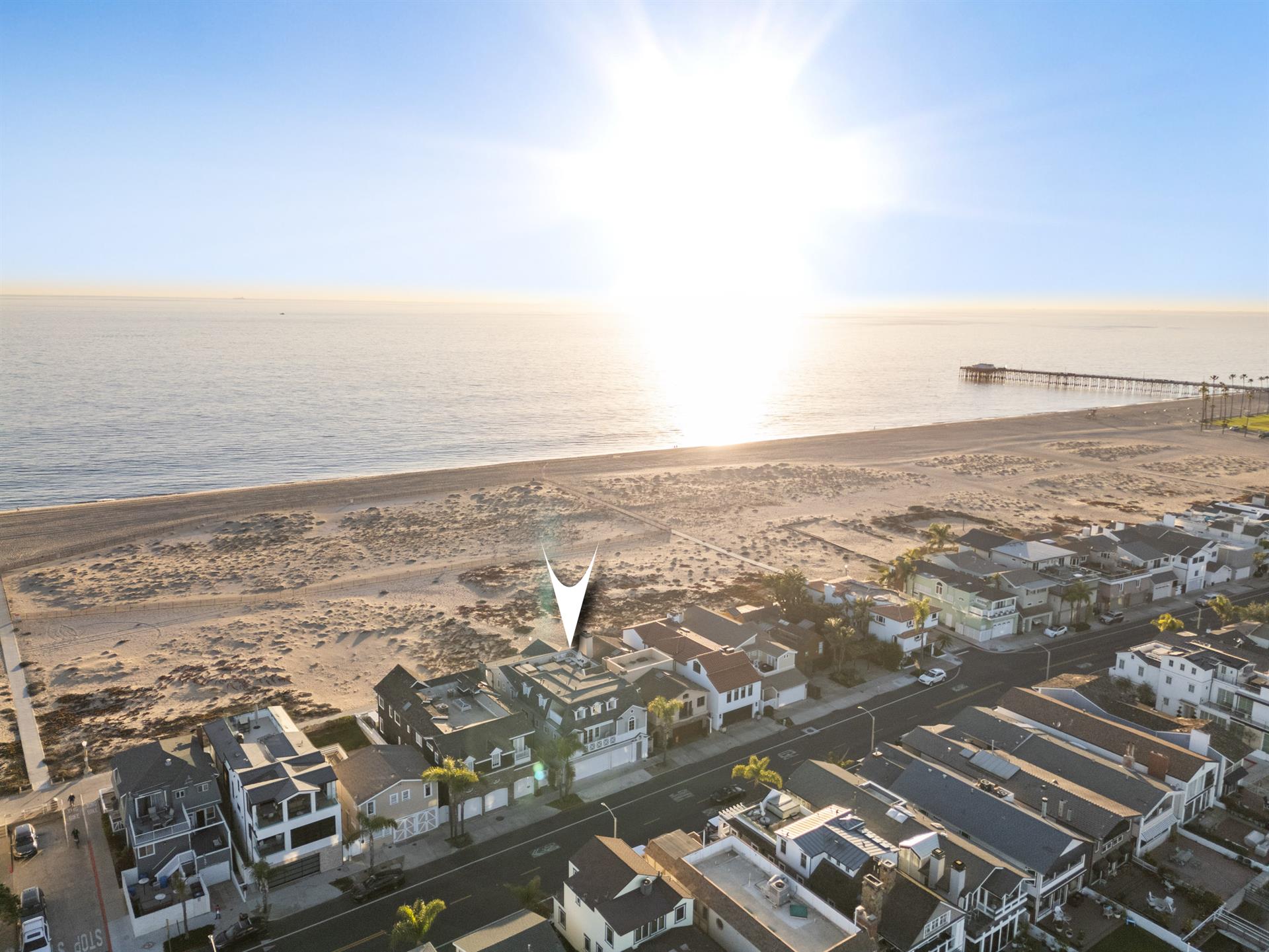 Aerial view of the beach with home pinpoint