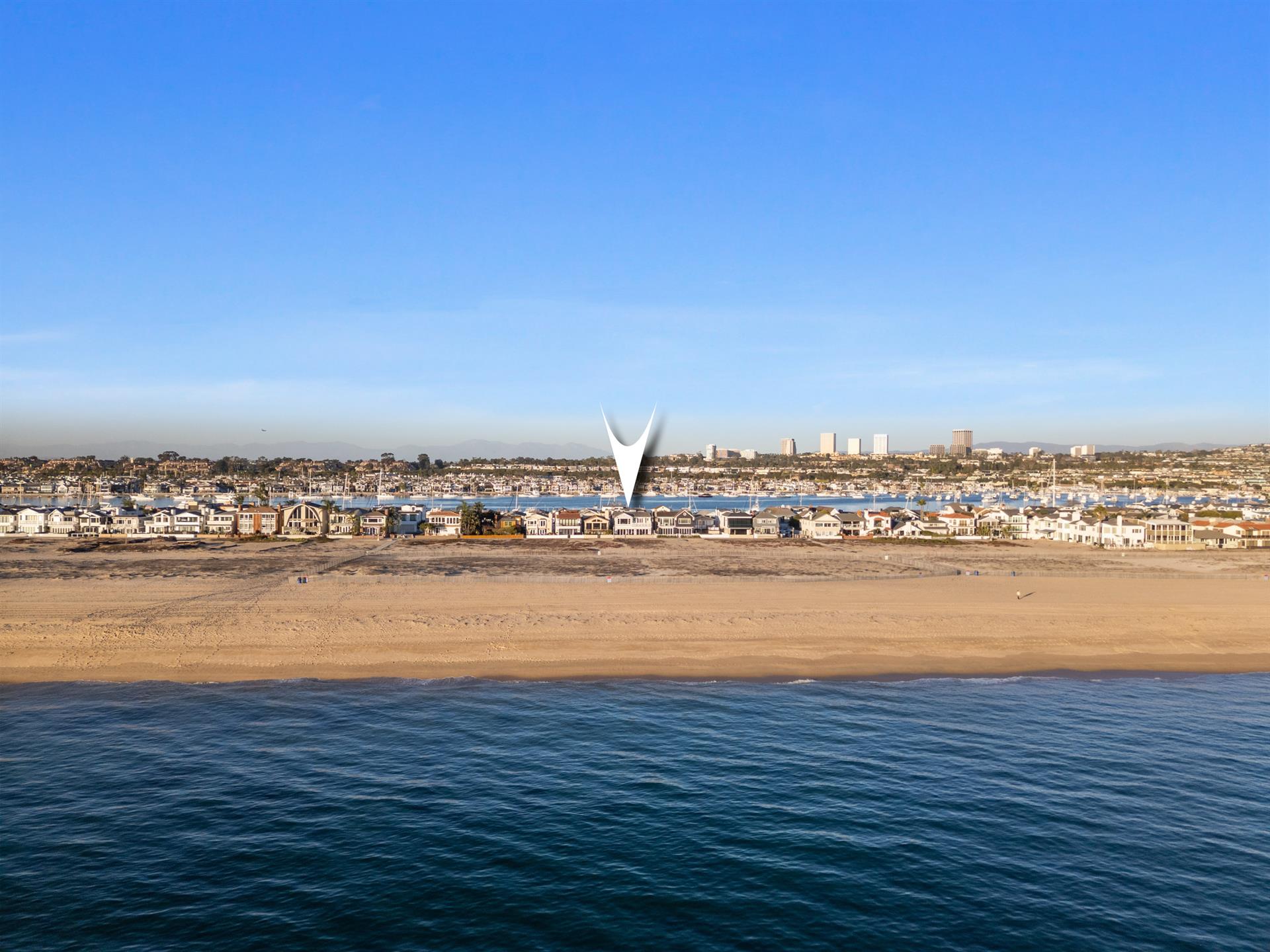 Aerial view of the beach with home pinpoint