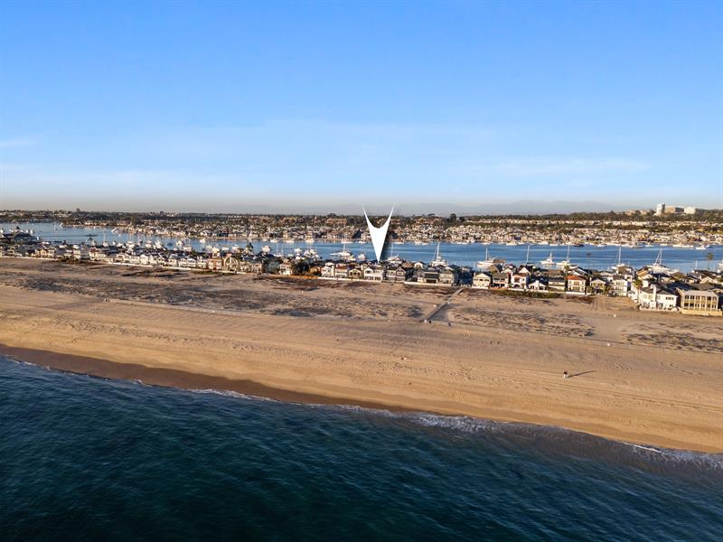 Aerial view of the beach with home pinpoint