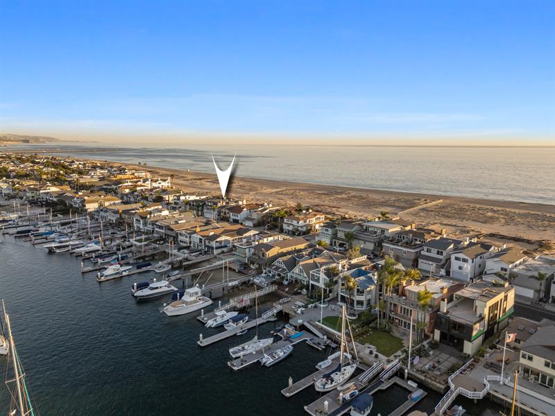 Aerial view of the beach with home pinpoint