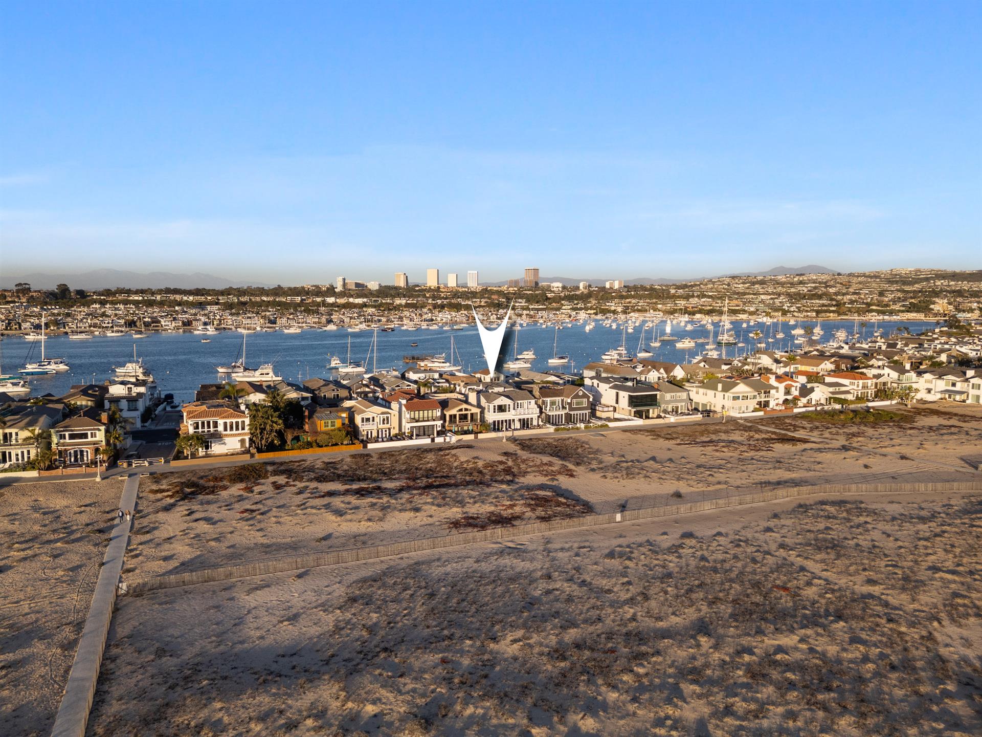 Aerial view of the beach with home pinpoint